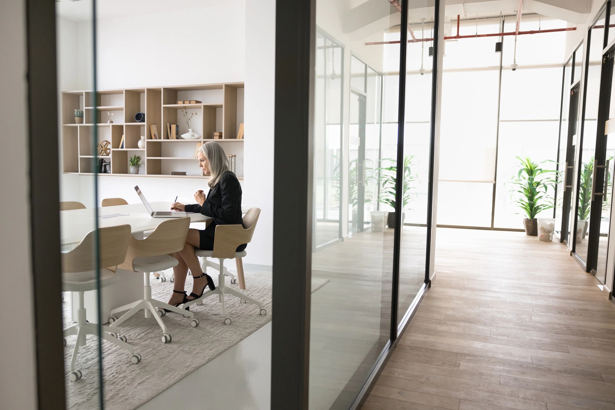 Consultant working independently in a modern meeting room