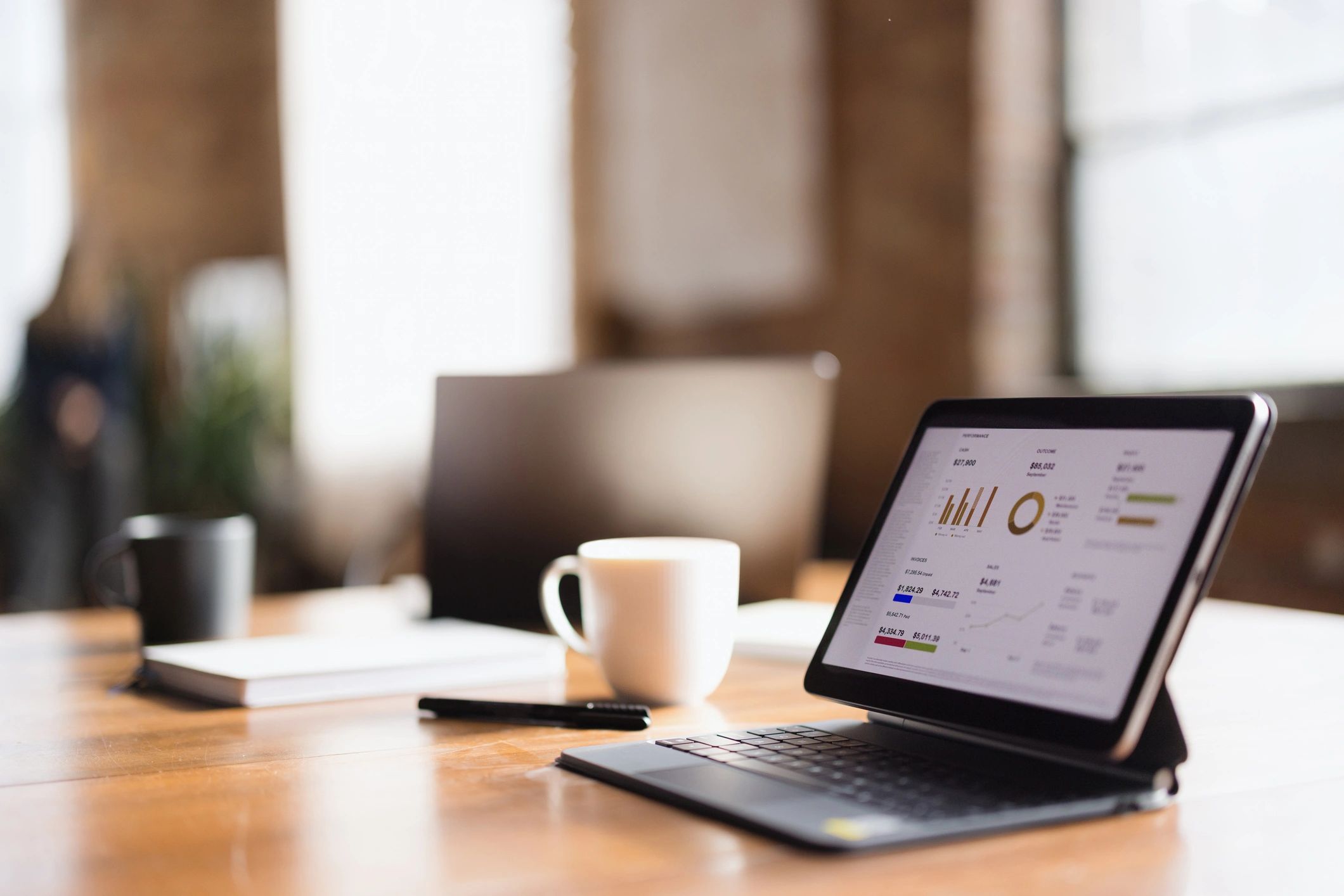 Business analytics workspace with tablet and chart